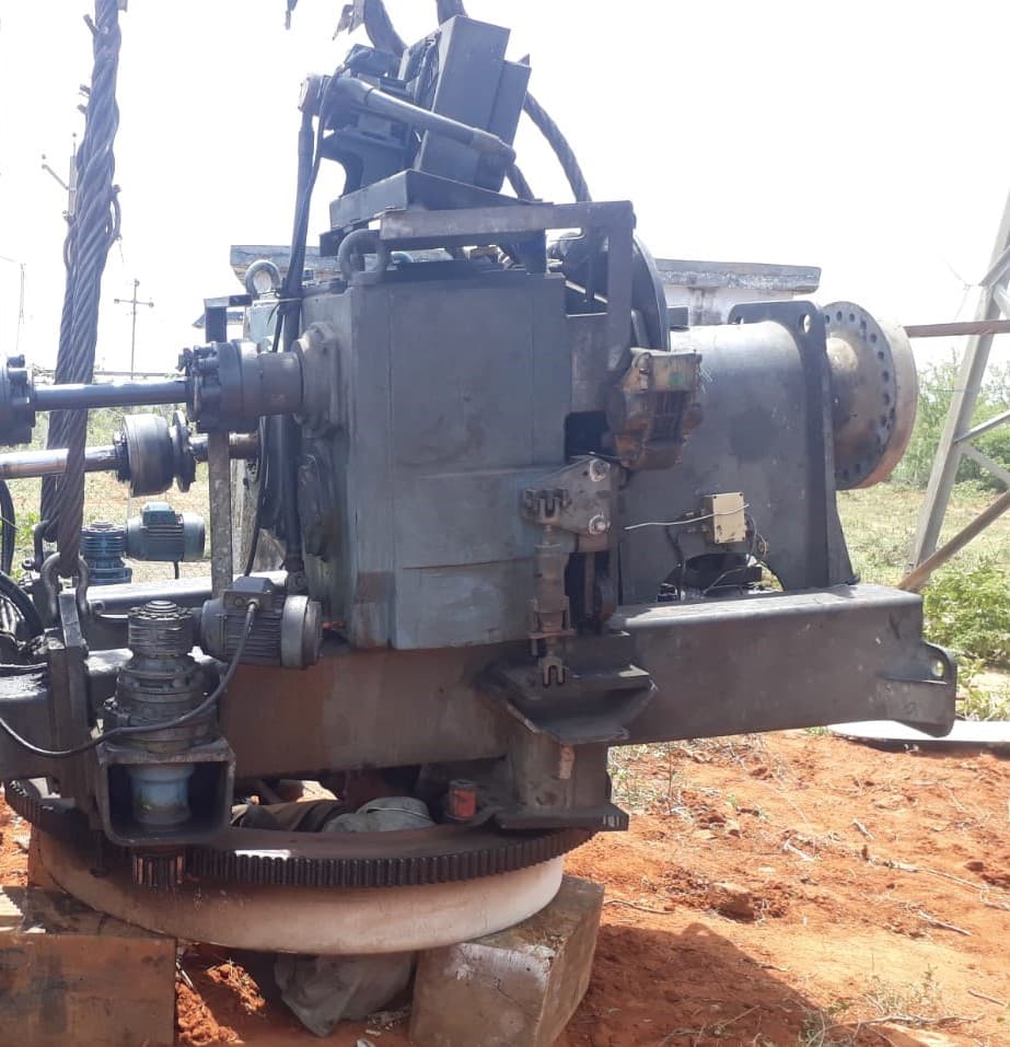 Wind turbine gearbox and generator assembly lifted by crane during repair and overhaul