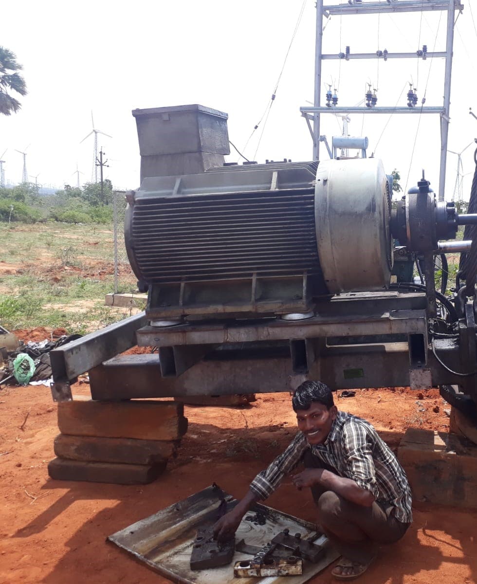 Wind turbine generator being serviced on site during rewinding work